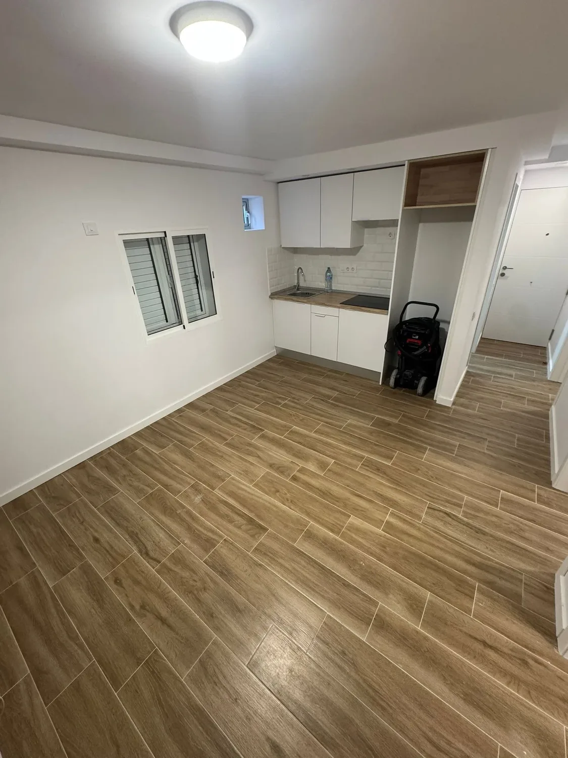 Salón reformado del proyecto Escaleritas con interiores cálidos